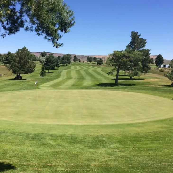 View of manicured golf course fairway